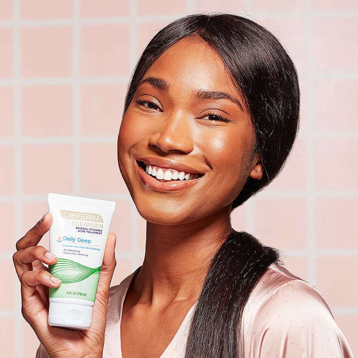 Differin Daily Deep Cleanser 4 Oz Banner showing a woman with clear skin, smiling and holding product bottle.