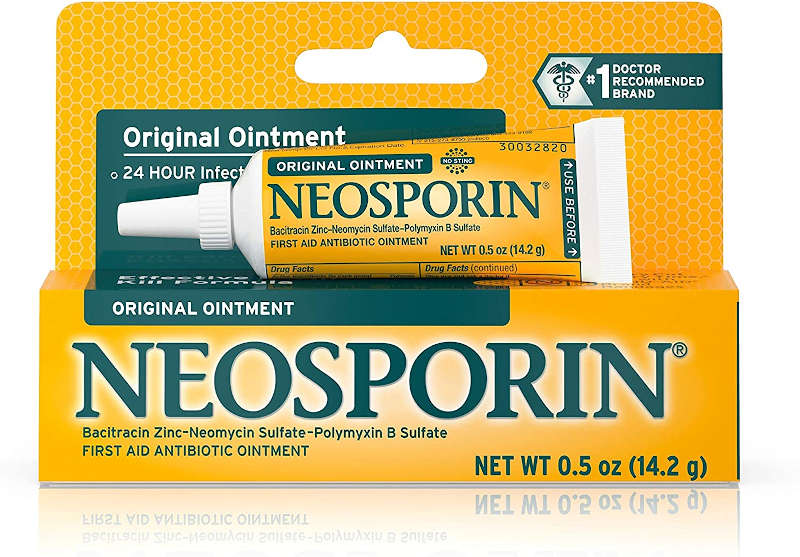 A tube of Neosporin Original First Aid Antibiotic Ointment placed on top of its outer packaging