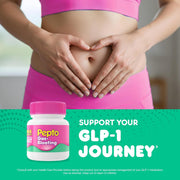 Person in pink athletic wear with hands on stomach, Pepto-Bismol bottle, and text about GLP-1 journey.