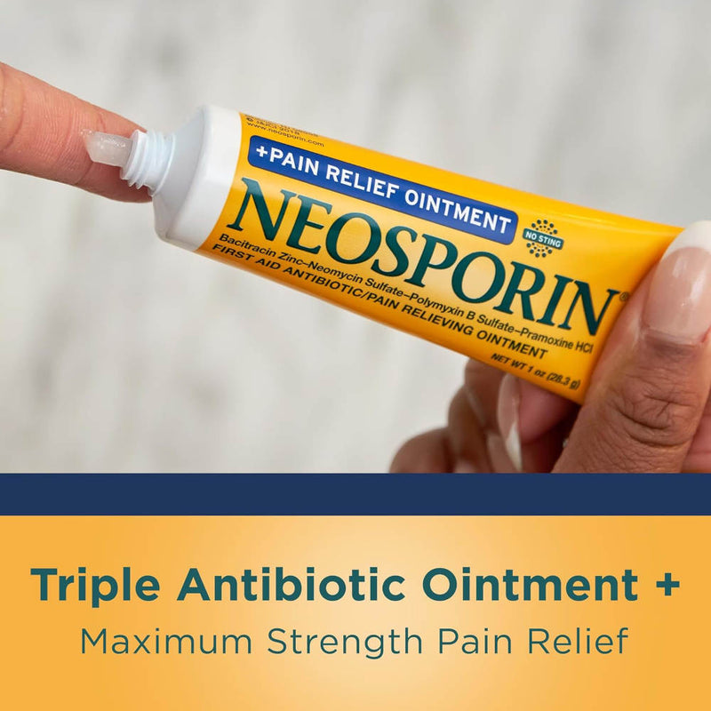 A hand holding a tube of Neosporin ointment with another hand pressing the cap, set against a soft light background. A dark blue banner at the bottom reads 'Triple Antibiotic Ointment + Maximum Strength Pain Relief'.