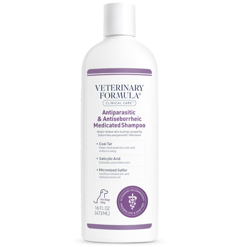 A 16 fl oz white bottle of Veterinary Formula Antiparasitic & Antiseptiche Medicated Shampoo for dogs, featuring purple text and accents on a white background.