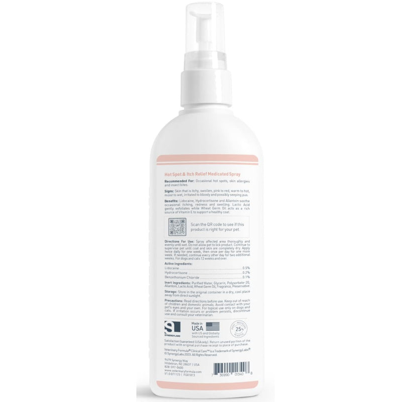 A white Veterinary Formula Clinical Care Hot Spot & Itch Relief Medicated  plastic spray bottle with a clear pump dispenser, shown from the back against a plain white background. The bottle features a light pink band near the top and a detailed black and gray ingredient and instructions label on the lower half.