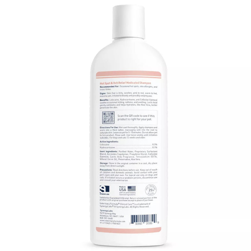Back view of a white Veterinary Formula Clinical Care medicated hot spot shampoo bottle with a dense product label, QR code, and barcode, standing against a plain white background; clean, clinical feel.