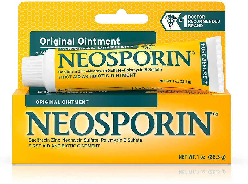 A 1 oz tube of Neosporin Original First Aid Antibiotic Ointment which has been placed on top of its outer packaging