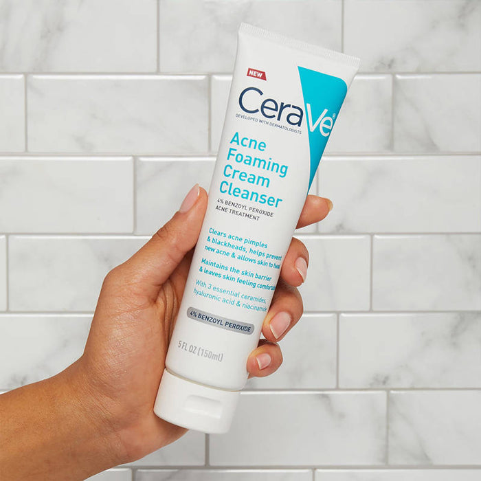CeraVe Acne Foaming Cleanser 5 Oz banner showing a hand holding product in a bathroom