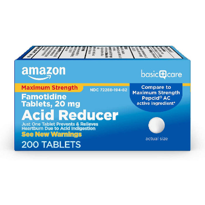 Amazon Basic Care 20mg Famotidine Tables In Front Of White Background.